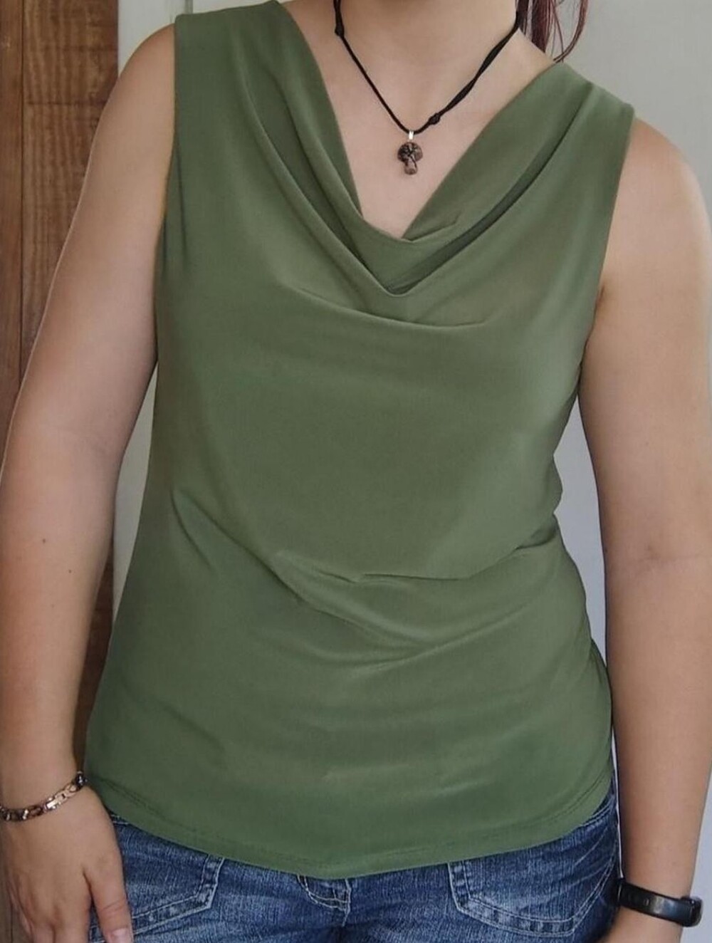 dark green sleeveless 90s style blouse with a ruched neckline